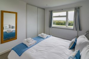 Ground floor King sized bedroom with sea views at Atlantic Breezes