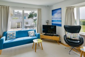Lounge with TV and views to garden at Atlantic Breezes