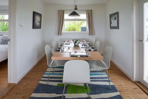 Seperate dining area with seating for eight, at Atlantic Breezes