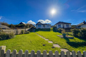 View from over the front garden to the front exterior of Wings