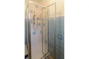 Shower room at Wings with shower cubicle