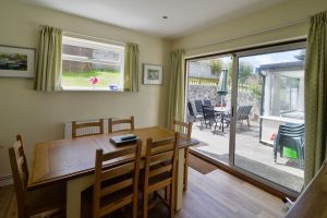 Dining area with doors to the patio at Wings