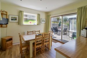 Dining area and doors to the rear patio at Wings