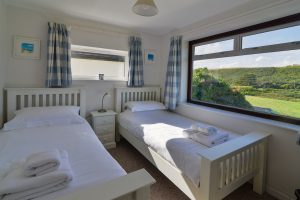 Twin bedroom at wings with window to front of the property