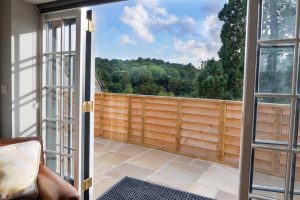Double patio doors leading to outside at The Studio at Pensile House