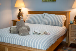 Double bed in master bedroom at Carrek Cottage