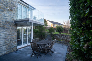 Outside patio with seating for six, upstairs balcony at Carrek Cottage