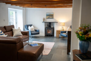 Lounge at Carrek Cottage with log burner