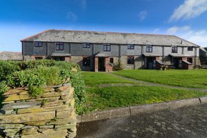 Front grassed area of Stable Cottage and adjoining properties from the road entrance