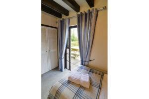 Door to outside area from the twin room at Stable Cottage