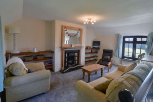 First floor lounge area at Stable Cottage with seating