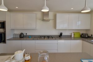 The kitchen area at Trebriani with built in oven and gas hob