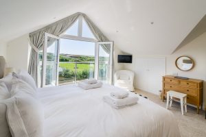First floor ensuite superking bedroom with large glass doors with Juliet balcony