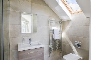 The master ensuite shower room at Trebriani with toilet and wash basin