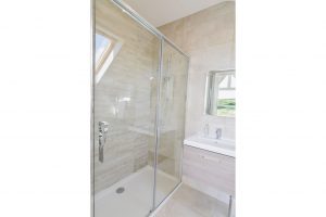 The ensuite shower room the the first floor king bedroom at Trebriani with shower cubicle and wash basin