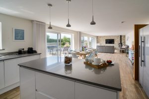 Interior view of the large open plan living area from the kitchen at Trebriani