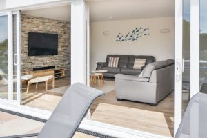 Lounge area from outside on the rear patio through the sliding doors at Trebriani