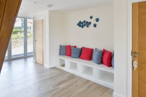 The large entrance area at Trebriani with fitted wooden seating