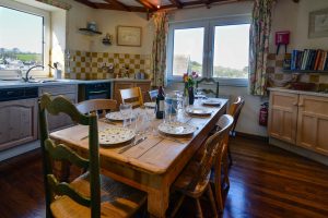 Dining table in well equipped kitchen at The Granite House