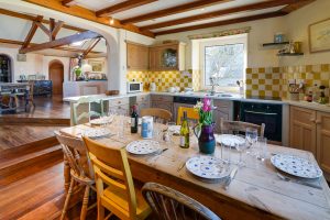 Dining table in well equipped kitchen at The Granite House