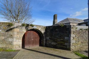 Large wooden front gate at The Granite House