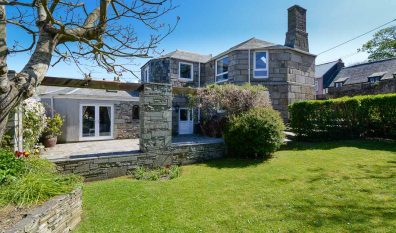 Exterior rear view of The Granite House with large grassed garden