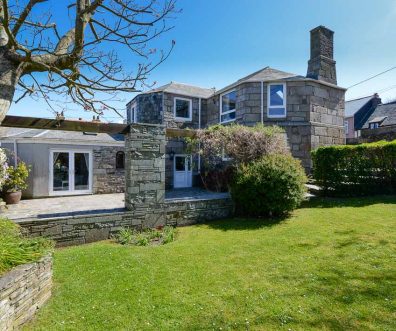 Exterior rear view of The Granite House with large grassed garden