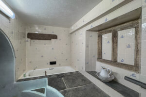 Stone bathroom with bath tub at The Granite House