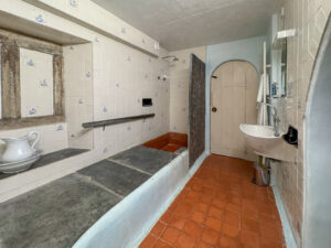 Ground floor stone bathroom with shower at The Granite House