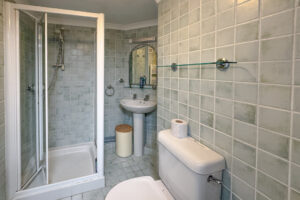 Ground floor bathroom with loo, basin and shower at The Granite House