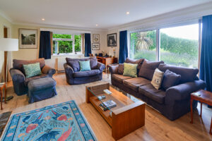 Lounge at Tamarisk with seating and large window to the front garden