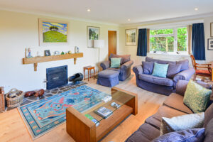 Lounge at Tamarisk with open fire and seating