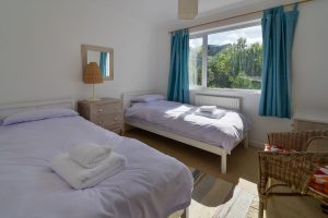 The second twin bedroom at The Riding with window to the rear garden