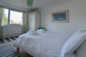The double bedroom at The Ridings with wardrobe and window to the front of the house