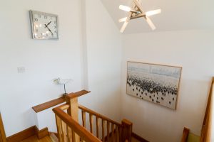 Staircase leading from the first floor at Little Tremawr