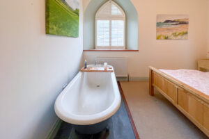 Free standing bath in King sized bedroom at Church House