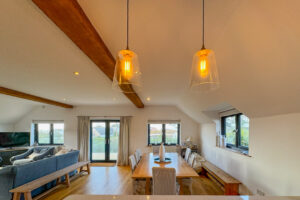 Oak beams over dining area on first floor at Little Tremawr