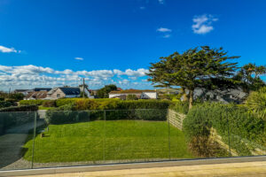 Views across the garden from the balcony at Little Tremawr