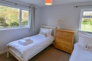 Ground floor twin bedroom with garden views at Little Tremawr