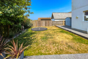 Grassed garden area with trampoline to the rear of Newlands