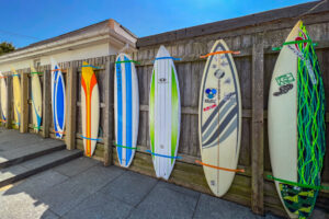 Surfboards hanging on the fence at Newlands