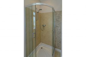Walk in shower in the en suite of bedroom 1