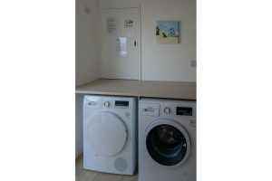 Utility area at Newlands with washing machine and tumble drier