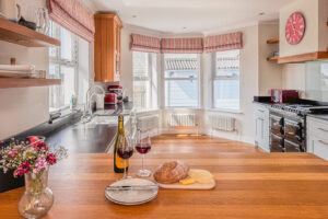 Kitchen at Newlands with large sash windows and AGA oven