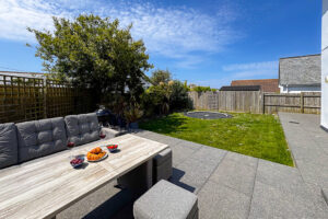 Patio and grassed garden area to the rear of Newlands