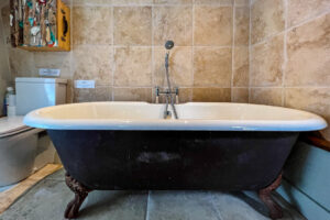 The bathroom with large bath at Millingworth Mill