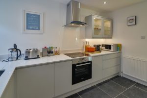 Kitchen at Rumah Panjang with integrated oven and electric hob