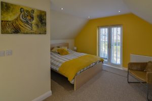 King sized bedroom on the first floor at Rumah Panjang with Juliette balcony