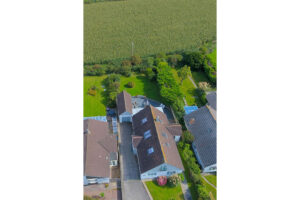 Ariel shot of Rumah Panjang with rural surroundings