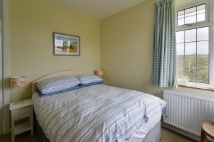 Double bedroom with bedside tables and lamps